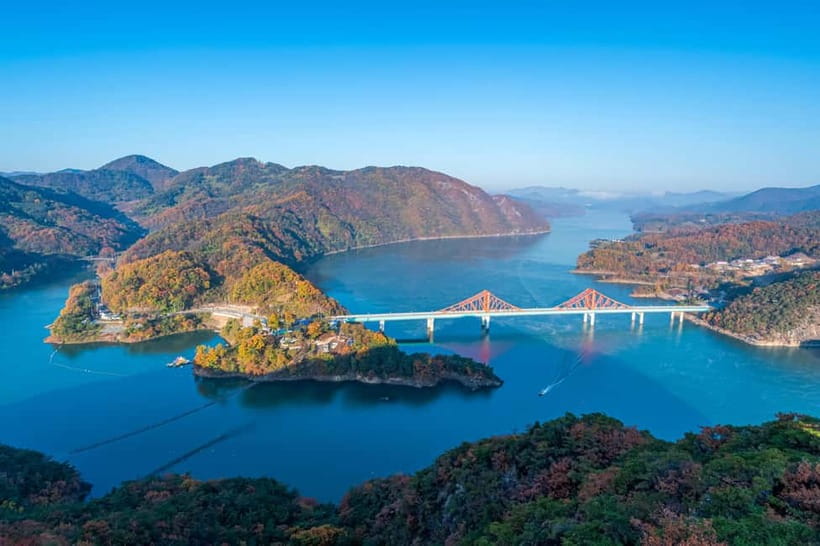 Seoul: Chungju Cruise, Cable Car & Cave Kayak Adventure Tour - Chungju Lake cruise: calm water, cliffs, and Korean narration