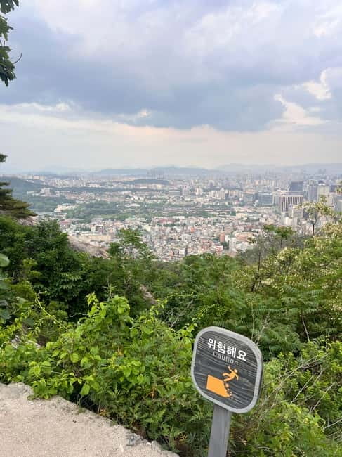 Seoul: Inwangsan Sunset Hike with Guide - Hanyang Fortress Wall stories you’ll understand while you walk