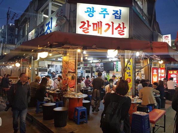 Seoul Night "Private Tour"(Korean BBQ, N-Tower, Seoul Fortress, Local Market) - Gwangjang Market at night: snacks, stalls, and time limits